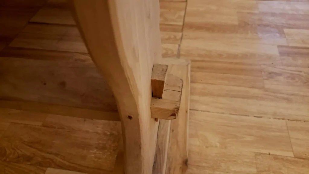 How To Build A Gorgeous Farmhouse Table from Scratch 10 wedge fixing of farmhouse table leg spreader